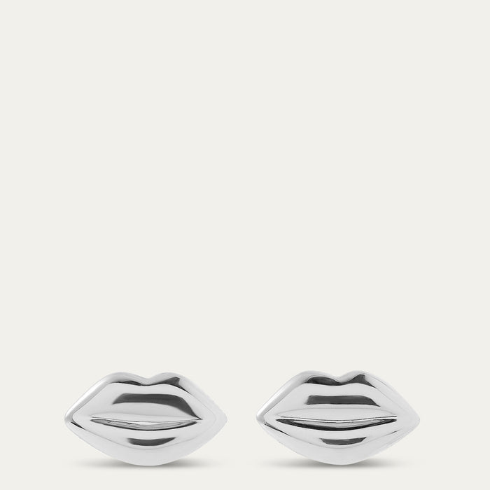 Silver lip-shaped earrings on a white background
