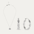Silver necklace, pendant, and hoop earrings on a white background