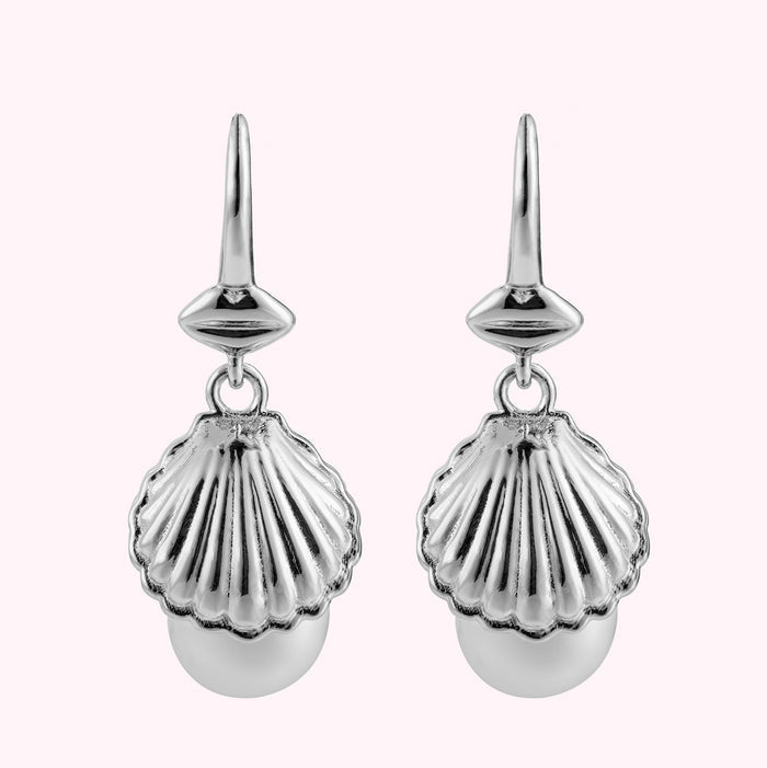 Front image of a pair of sterling silver shell shaped drop earrings with freshwater pearls.