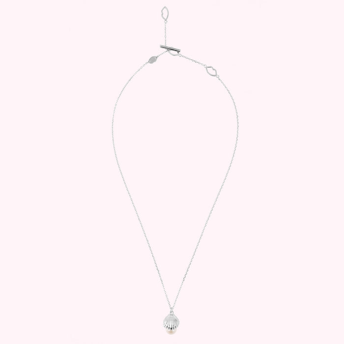 Sterling silver shell pendant with a freshwater pearl, lip chain links and engraved L.G monogram.