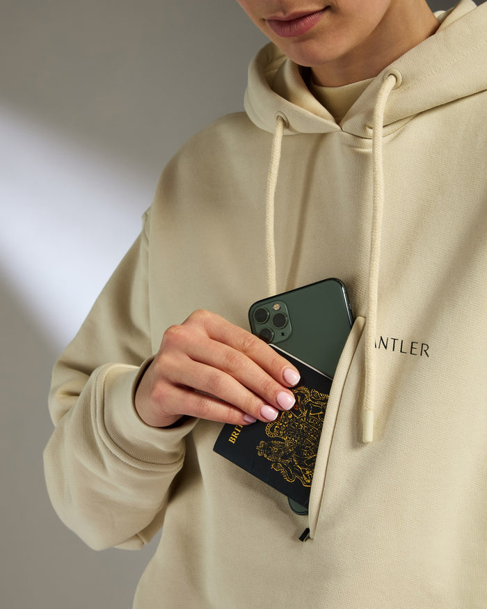 a person holding a phone in their pocket