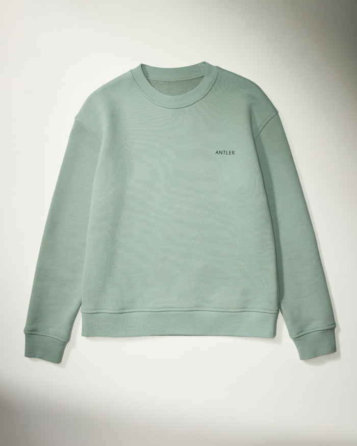 a green sweater on a white background