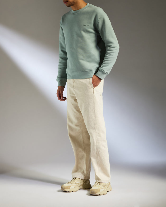 a man standing with his hands in his pockets