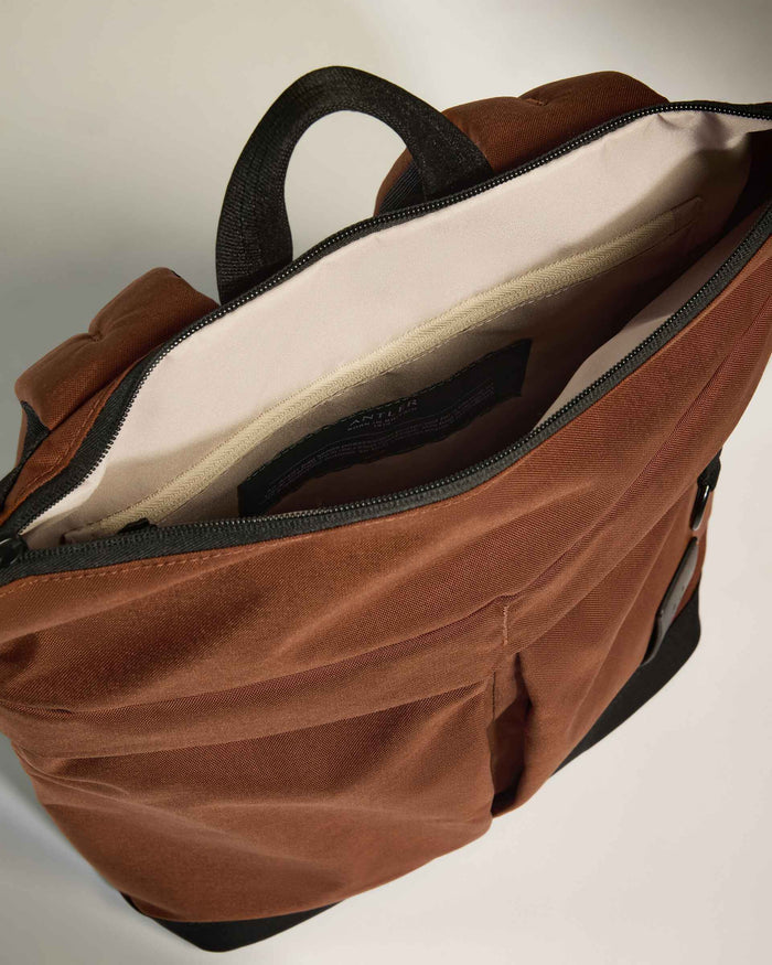 a brown bag with a black handle