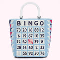 Light blue tote bag with a bingo card design and clear handles.