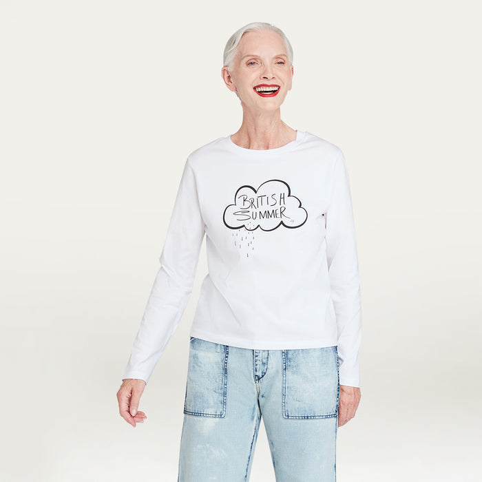 Person wearing a white sweatshirt with 'British Summer' text on the front and light blue jeans on a plain background