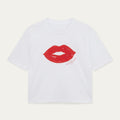 White t-shirt with red lips graphic and text on a light gray background