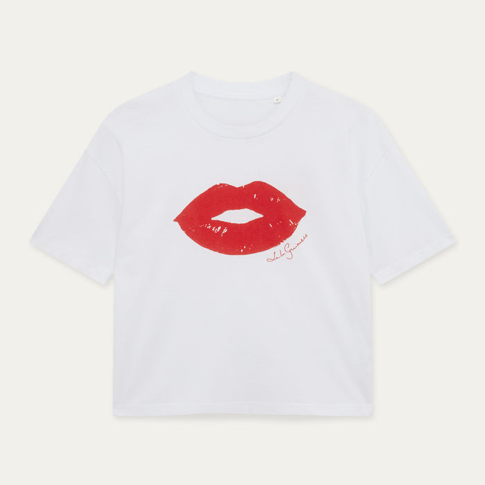 White t-shirt with red lips graphic and text on a light gray background