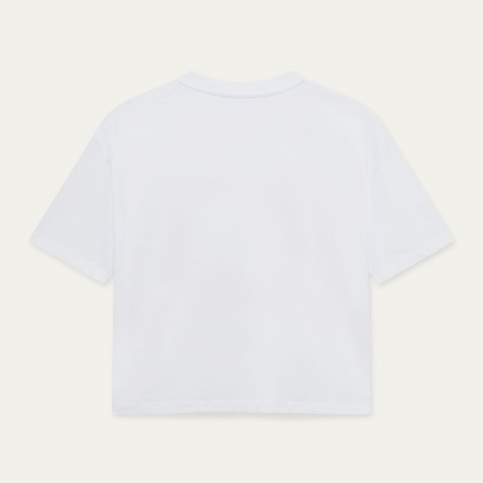 White t-shirt on a light beige background